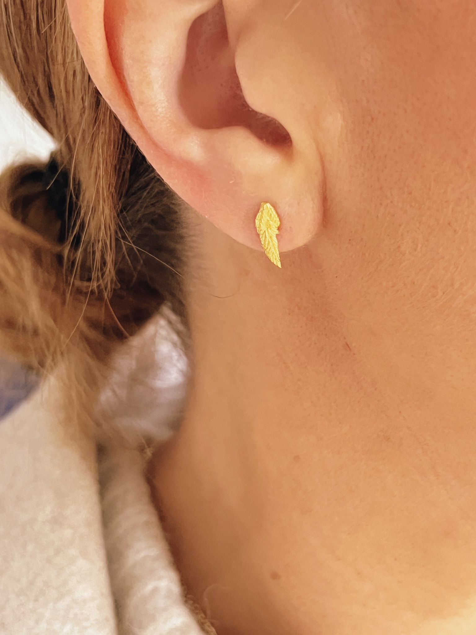 Gold feather on sale stud earrings